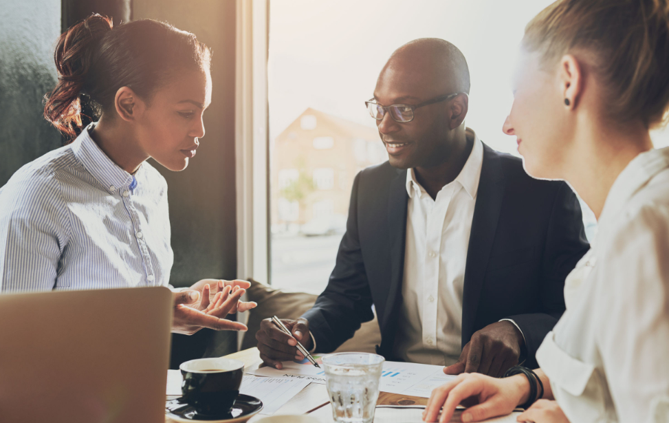 people discussing business over coffee